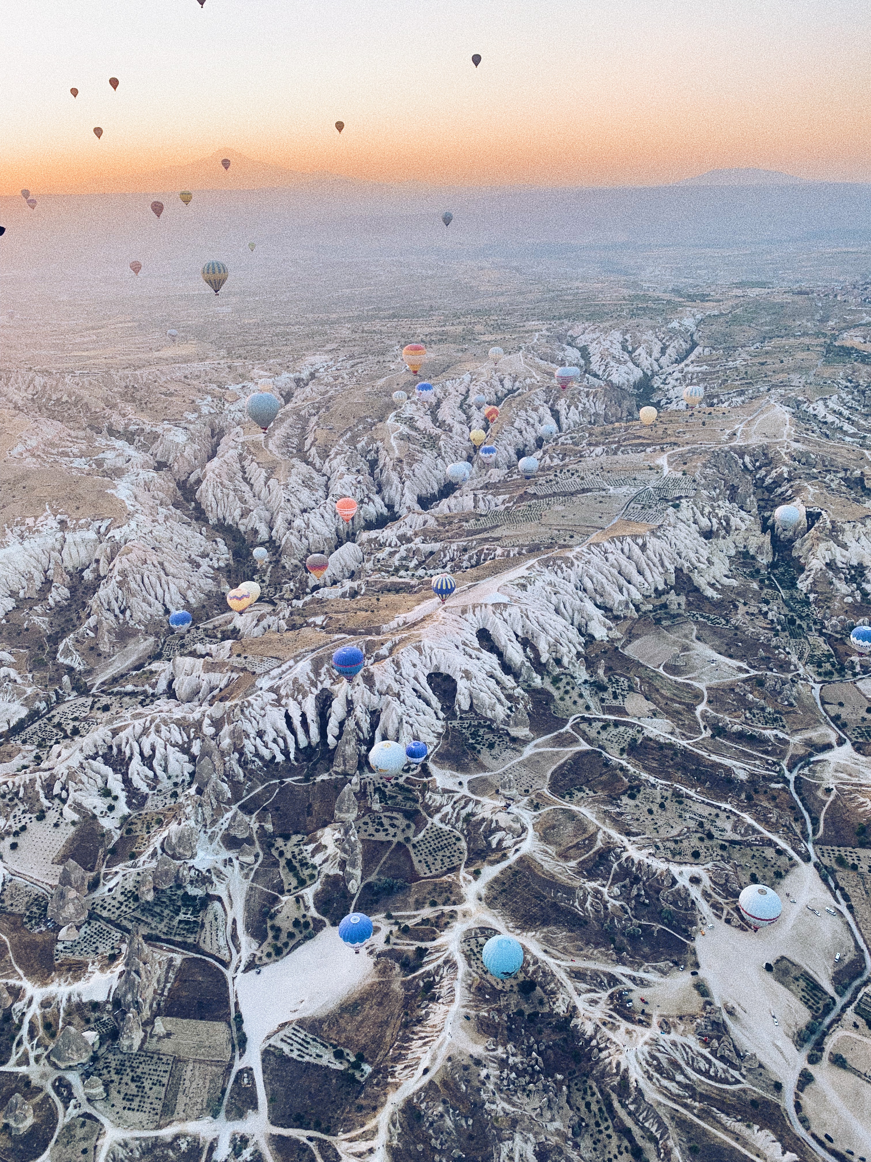 An aerial view of hot air balloons over Kapadokya, Turkey